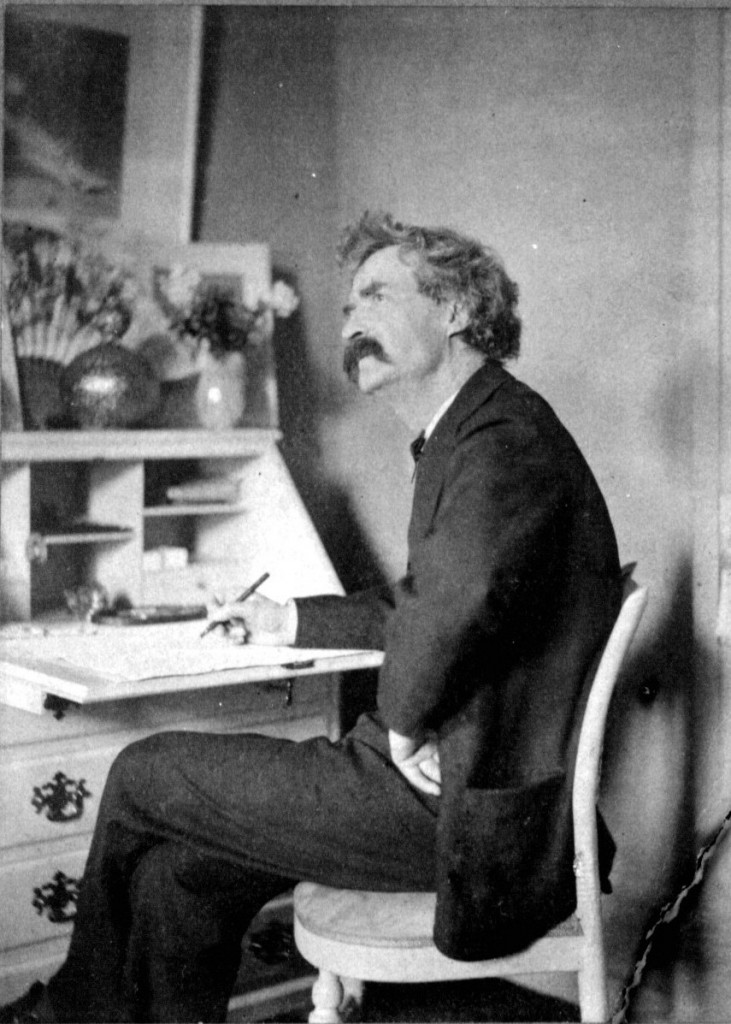 Mark_Twain_pondering_at_desk